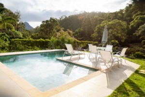 Beautiful landscaping surrounds a private swimming pool